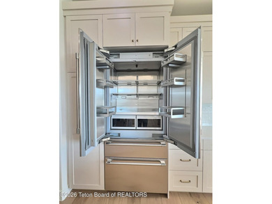 This home perfectly blends luxury with practicality. It offers a - photo 18