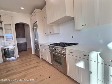 This home perfectly blends luxury with practicality. It offers a - photo 19