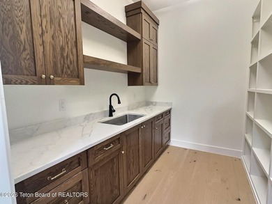 This home perfectly blends luxury with practicality. It offers a - photo 34