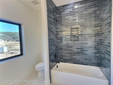 This home perfectly blends luxury with practicality. It offers a - photo 43