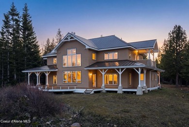 Perched above Lake Pend Oreille on 95+ acres, this extraordinary - photo 2