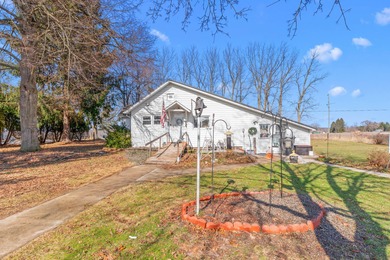 A homestead with 6 acres, several buildings that are set up for