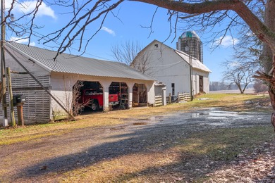 A homestead with 6 acres, several buildings that are set up for