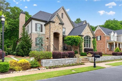Nestled within the prestigious River District, a coveted gated - photo 2