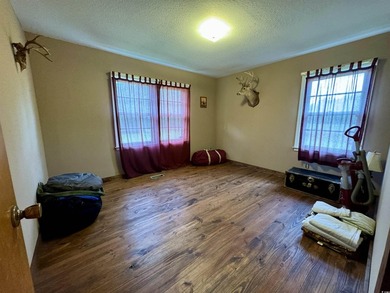 Lovely brick ranch-style home with just over 12 acres! Through - photo 13