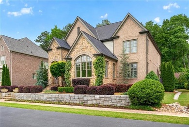 Nestled within the prestigious River District, a coveted gated - photo 3