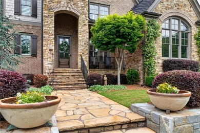 Nestled within the prestigious River District, a coveted gated - photo 5