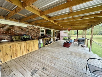 Lovely brick ranch-style home with just over 12 acres! Through - photo 16
