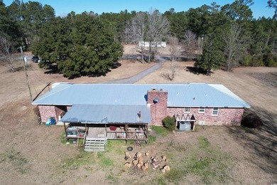 Lovely brick ranch-style home with just over 12 acres! Through - photo 17