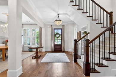 Nestled within the prestigious River District, a coveted gated - photo 9