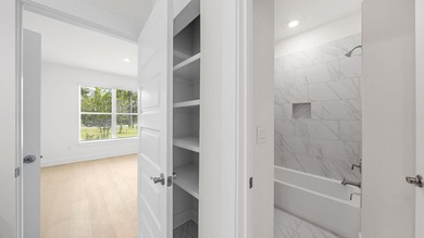 Situated on nearly three-quarters of an acre, this exceptional - photo 20