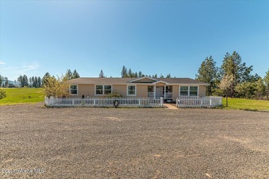 This spacious 4-bedroom, 2-bathroom home sits on an impressive - photo 2