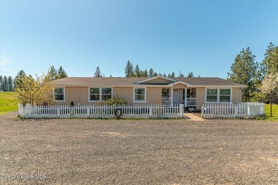 This spacious 4-bedroom, 2-bathroom home sits on an impressive - photo 3