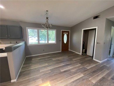 This home checks a lot of boxes: Location, blacktop to your door - photo 12
