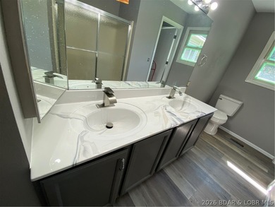 This home checks a lot of boxes: Location, blacktop to your door - photo 24