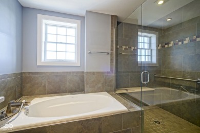 Welcome to luxury living in the heart of downtown Carmel! This
