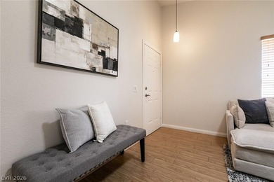 Beautiful single-story end-unit townhome located in a gated