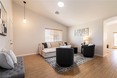 Beautiful single-story end-unit townhome located in a gated