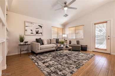 Beautiful single-story end-unit townhome located in a gated