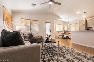 Beautiful single-story end-unit townhome located in a gated