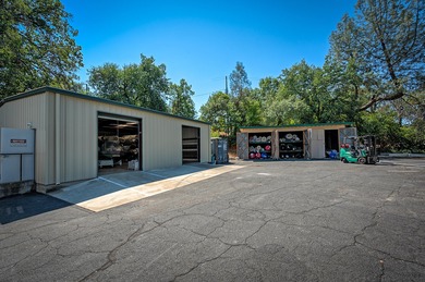 Lot is 30,928 sq ft with 3 buildings. The main building is a two - photo 15
