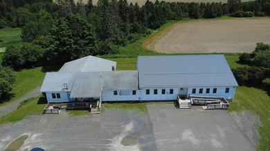 Situated just outside of town, this unique commercial property