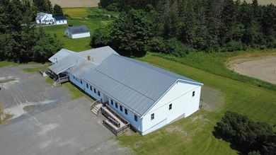 Situated just outside of town, this unique commercial property