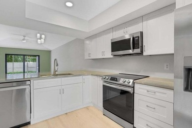 Make this beautifully remodeled 2-bedroom, 2-bath villa in - photo 7