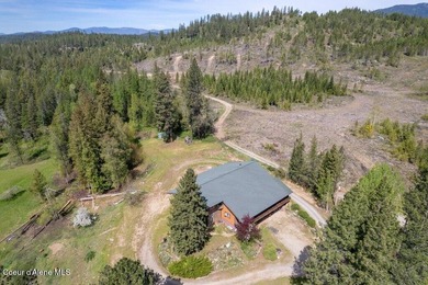 Tucked away in a private, park-like setting in North Idaho, this - photo 3