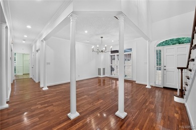 Nestled on a wooded golf course lot in the sought-after - photo 11