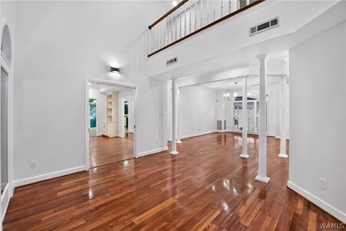 Nestled on a wooded golf course lot in the sought-after - photo 14