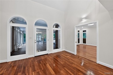 Nestled on a wooded golf course lot in the sought-after - photo 15