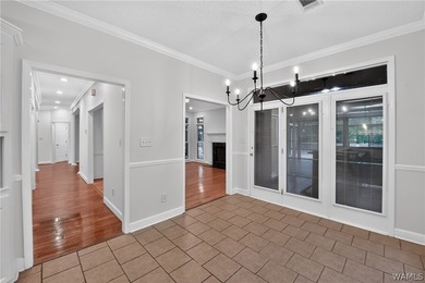 Nestled on a wooded golf course lot in the sought-after - photo 19