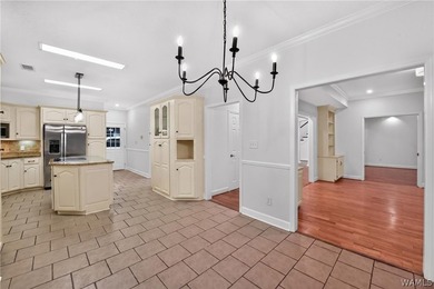 Nestled on a wooded golf course lot in the sought-after - photo 22