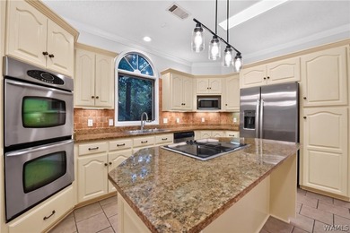 Nestled on a wooded golf course lot in the sought-after - photo 23