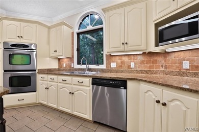 Nestled on a wooded golf course lot in the sought-after - photo 25