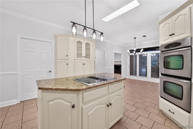 Nestled on a wooded golf course lot in the sought-after - photo 26