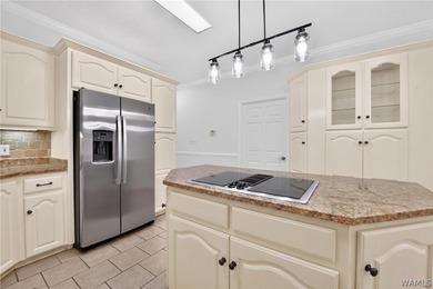 Nestled on a wooded golf course lot in the sought-after - photo 27