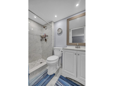Completely updated first floor 2 bedroom, 2 bath residence in - photo 9