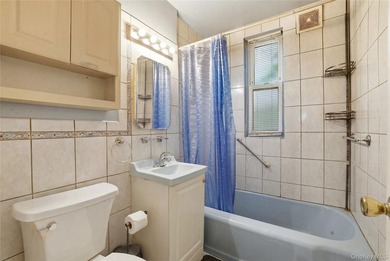 Charming brick home in tree-lined Oakland Gardens. This - photo 15
