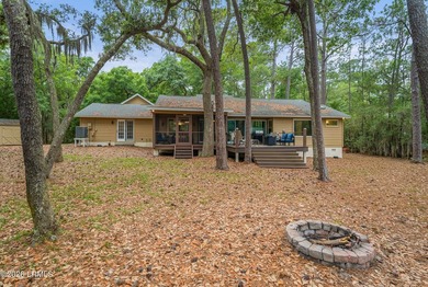 Tucked away on over an acre of wooded privacy with marsh views - photo 31