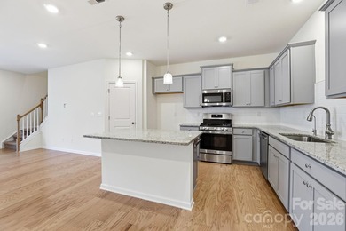 Welcome Home to this BETTER THAN NEW move-in ready townhome in - photo 4