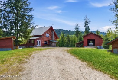 Escape to this mountain sanctuary located in Sagle, Idaho. This - photo 1