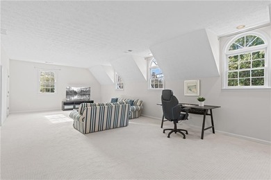 This beautiful brick traditional, majestically set back on the