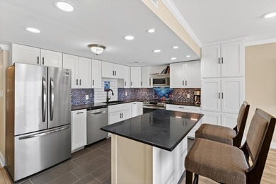 Rare opportunity to own a 3rd-floor end unit in the gated - photo 11