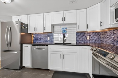 Rare opportunity to own a 3rd-floor end unit in the gated - photo 14