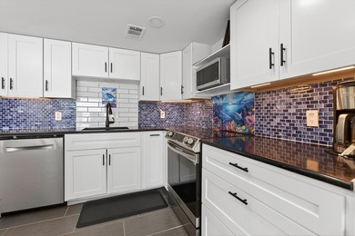 Rare opportunity to own a 3rd-floor end unit in the gated - photo 15