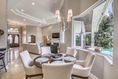 Nestled within the exclusive gated community of Islands of - photo 14