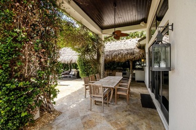 Nestled within the exclusive gated community of Islands of - photo 47