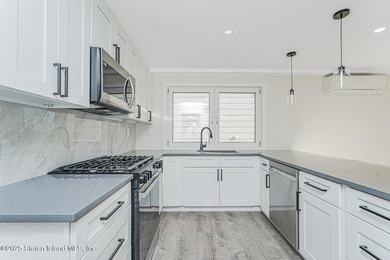 'This elegant 2 Family home features a sophisticated stocco and - photo 14